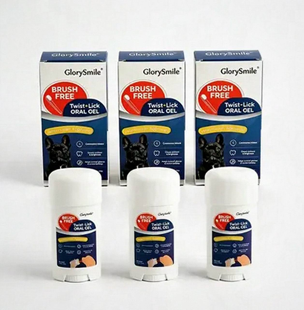 GlorySmile Twist and Lick applicator on a wooden table beside a Labrador's water bowl